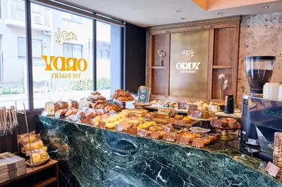 a bakery with a variety of pastries on display at Hotel Vintage Tokyo Meguro Fudomae in Tokyo
