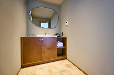 a bathroom with a sink and a mirror at Hotel Vintage Tokyo Meguro Fudomae in Tokyo