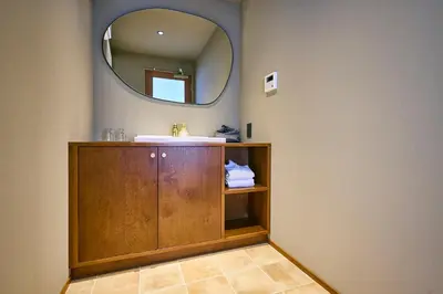 a bathroom with a sink and a mirror at Hotel Vintage Tokyo Meguro Fudomae in Tokyo