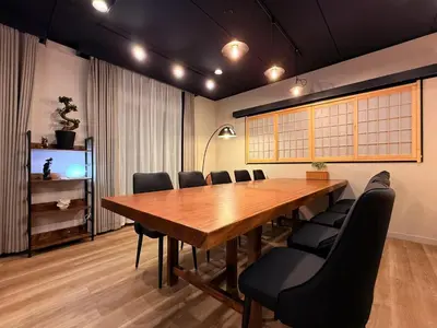 a conference room with a wooden table and chairs at The Hills Suite Daikanyama & Omotesando-Shibuya-Harajuku-Meiji Shrine & 10-minute walk from Daikanyama in Tokyo