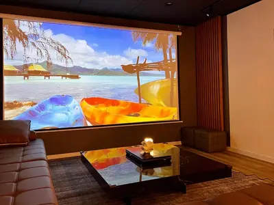 a living room with a large window with a picture of a boat at The Hills Suite Daikanyama & Omotesando-Shibuya-Harajuku-Meiji Shrine & 10-minute walk from Daikanyama in Tokyo