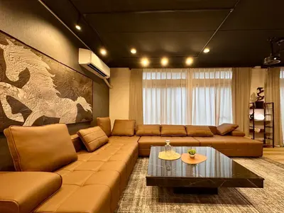 a living room with a couch and a coffee table at The Hills Suite Daikanyama & Omotesando-Shibuya-Harajuku-Meiji Shrine & 10-minute walk from Daikanyama in Tokyo