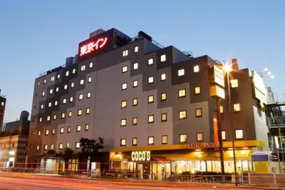 a building with a neon sign on top of it at Tokyo Inn - Vacation STAY 26689v in Tokyo