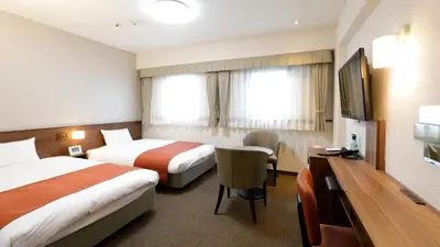 a hotel room with two beds and a television at Tokyo Inn - Vacation STAY 26708v in Tokyo