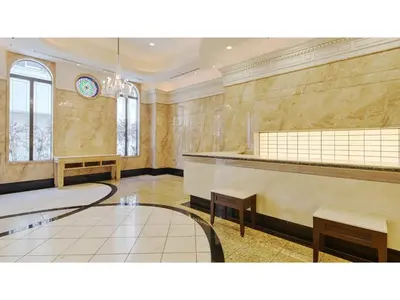 a waiting room with benches and a clock on the wall at The OneFive Tokyo Kameido - Vacation STAY 64573v in Tokyo