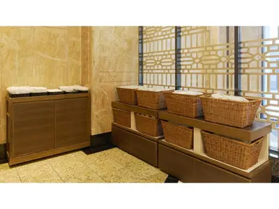 a row of wicker baskets on shelves in a bathroom at The OneFive Tokyo Kameido - Vacation STAY 64595v in Tokyo