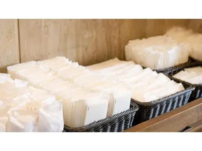 a bunch of cheese in baskets on a shelf at The OneFive Tokyo Kameido - Vacation STAY 64628v in Tokyo