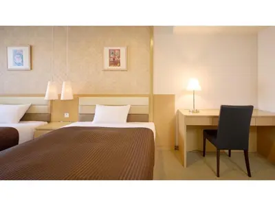 a hotel room with two beds and a desk at The OneFive Tokyo Kameido - Vacation STAY 64628v in Tokyo