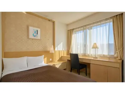 a hotel room with a bed and a desk and a window at The OneFive Tokyo Kameido - Vacation STAY 64577v in Tokyo