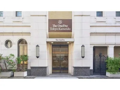a building with the entrance to a taji zimbabwe at The OneFive Tokyo Kameido - Vacation STAY 64577v in Tokyo