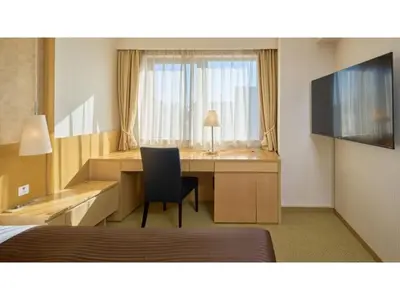 a room with a desk with a chair and a window at The OneFive Tokyo Kameido - Vacation STAY 64577v in Tokyo