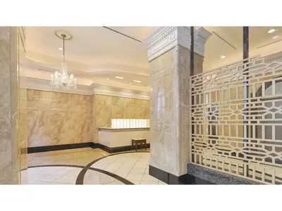 a lobby of a building with a chandelier at The OneFive Tokyo Kameido - Vacation STAY 64608v in Tokyo