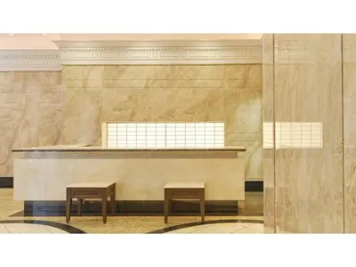 a lobby with two stools in front of a counter at The OneFive Tokyo Kameido - Vacation STAY 64608v in Tokyo