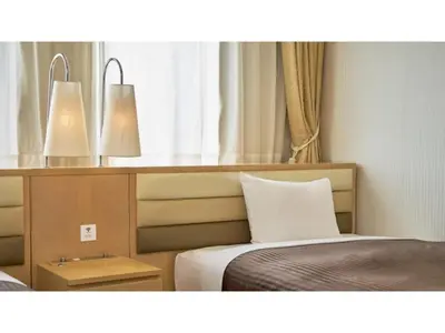 two lights above a bed in a room at The OneFive Tokyo Kameido - Vacation STAY 64611v in Tokyo