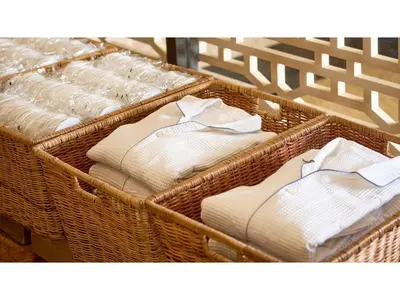 a group of baskets filled with white towels at The OneFive Tokyo Kameido - Vacation STAY 64611v in Tokyo