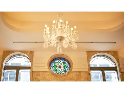 a chandelier in a room with three windows at The OneFive Tokyo Kameido - Vacation STAY 64559v in Tokyo