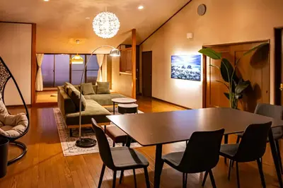 a living room with a table and a couch at Otsu Building - Vacation STAY 18729 in Tokyo