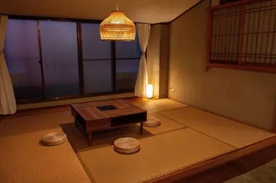 a living room with a table and a chandelier at Otsu Building - Vacation STAY 18729 in Tokyo