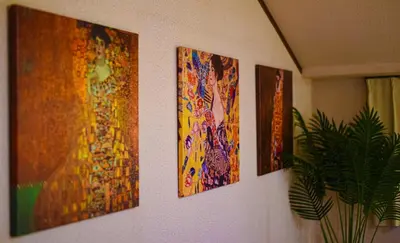 a group of four paintings hanging on a wall at Otsu Building - Vacation STAY 18729 in Tokyo