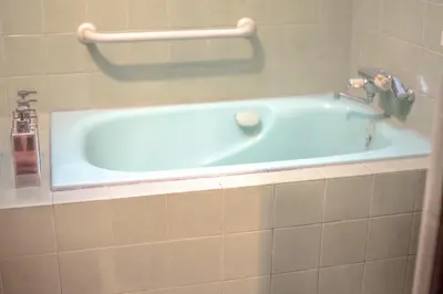a bath tub in a bathroom with a sink at Otsu Building - Vacation STAY 18729 in Tokyo