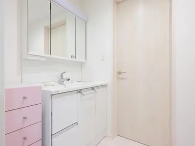 a white bathroom with a sink and a shower at Four Seasons Yado1 in Tokyo