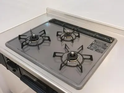 a stove top with three burners on top of it at Four Seasons Yado1 in Tokyo