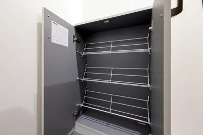 a locker room with metal shelves in a door at Brio\u9ad8\u4e95\u6238 in Tokyo