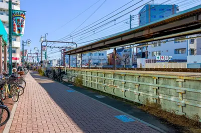 a group of bikes parked on a brick sidewalk at Brio\u9ad8\u4e95\u6238 in Tokyo