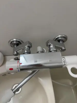 a close up of a toilet handle in a bathroom at SHIBUYA Room in Tokyo
