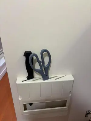 a pair of scissors sitting on top of a drawer at SHIBUYA Room in Tokyo