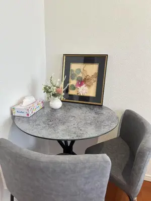 a table with two chairs and a picture on it at SHIBUYA Room in Tokyo