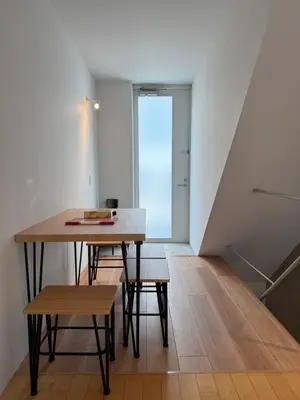 a small room with a table and chairs and a window at Lumiere Minami-Shinagawa B in Tokyo