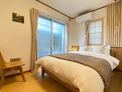 a bedroom with a bed and a large window at N28-Tokyo Shinjuku Luxury Villa 110 SPM in Tokyo