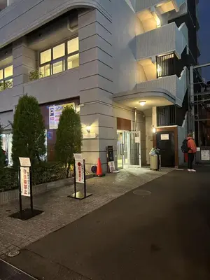 a person standing in front of a building at Shibuya\u306e\u5bbf in Tokyo