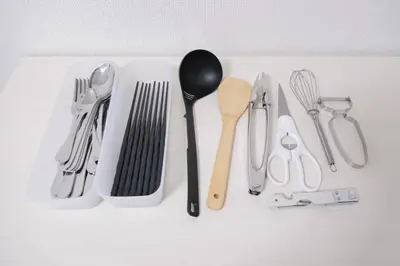 a group of utensils sitting on top of a table at Sumire in Tokyo