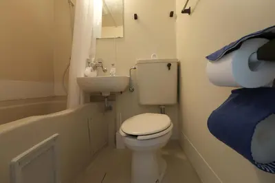a small bathroom with a toilet and a sink at 5min walk to Kameari Station within 30min to Ginza, Asakusa, Skytree Direct bus to Haneda Airport & Tokyo Disneyland departing from Kameari Station in Tokyo