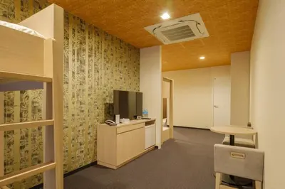an office with a tv and a desk and a table at Tosei Hotel Cocone Kamata in Tokyo