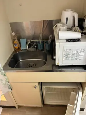 a kitchen counter with a sink and a microwave at ksmst in Tokyo