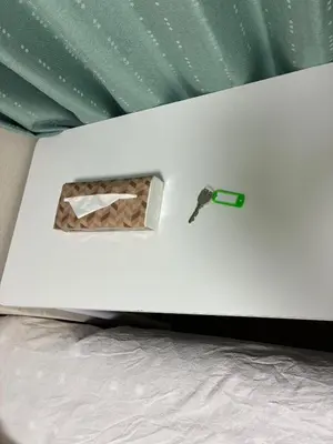 a screwdriver sitting on top of a white bed at ksmst in Tokyo