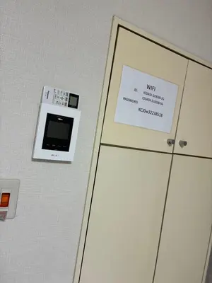 a room with a door with a sign on it at ksmst in Tokyo