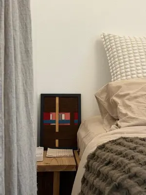 a bed with a wooden night stand next to a bed with a bed gmaxwell gmaxwell at M House Tokyo Omori\u99c5 in Tokyo