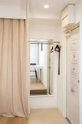 a room with a mirror and a table in a room at M House Tokyo Omori\u99c5 in Tokyo