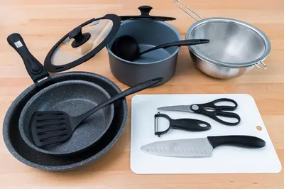 a frying pan and utensils on a table at Skytree City Suites OSHIAGE in Tokyo