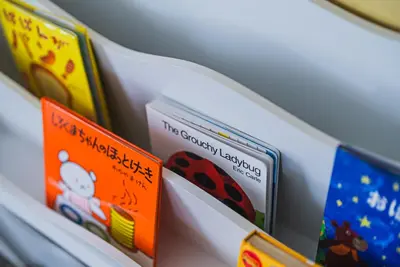 a row of books sitting on a shelf at Skytree City Suites OSHIAGE in Tokyo