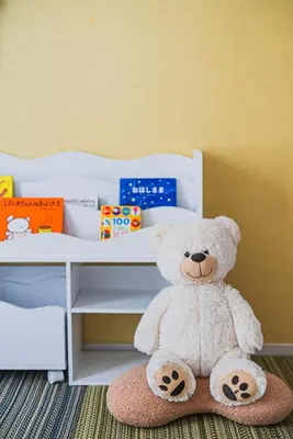 a white teddy bear sitting under a desk at Skytree City Suites OSHIAGE in Tokyo
