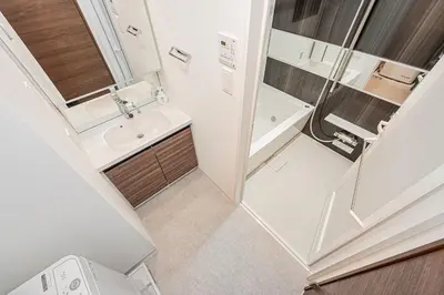 a small bathroom with a sink and a shower at Japan House \u5fa1\u5f92\u753a in Tokyo