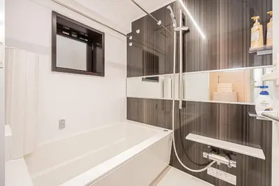 a bathroom with a shower and a sink at Japan House \u5fa1\u5f92\u753a in Tokyo