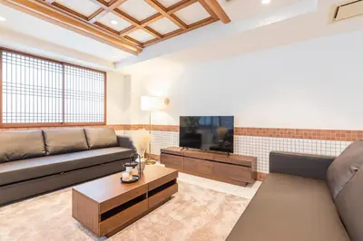 a living room with a couch and a tv at Residence Akasaka Comfort in Tokyo