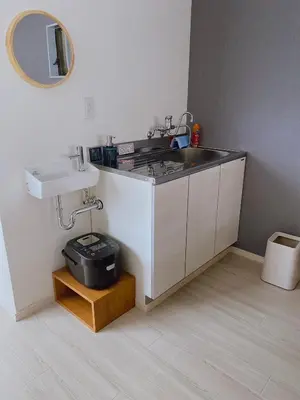 a small kitchen with a sink and a sink at Residence Shinamachi in Tokyo