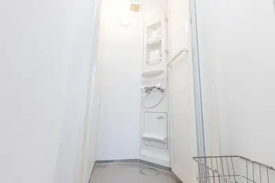 a bathroom with an open refrigerator in a room at Residence Shinamachi in Tokyo